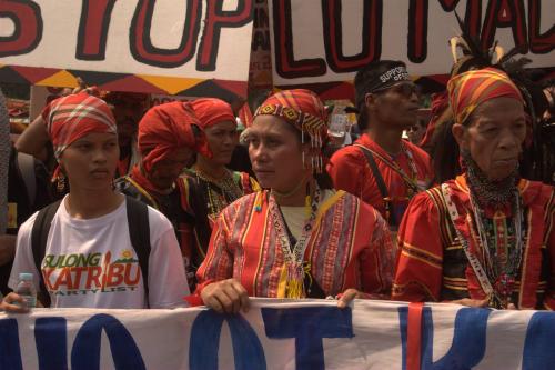 ​Aida Seisa (middle), with Ata Manobo leader Bai Bibiyaon Ligkayan Bigkay (right) and Michelle Campos (left), daughter of slain Lumad leader Dionel Campos, lead the Manilakbayan 2015 contingent in a protest action in Manila, Philippines. 